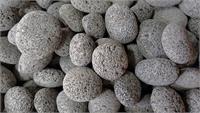 Rolled Lava stones commonly referred to as Tumbled Lava Rock for use in outdoor fire pit designs